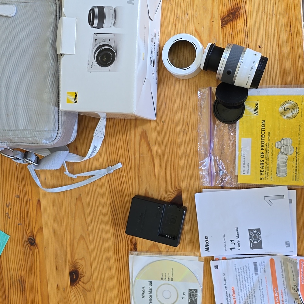 Compact Silver Camera with Accessories